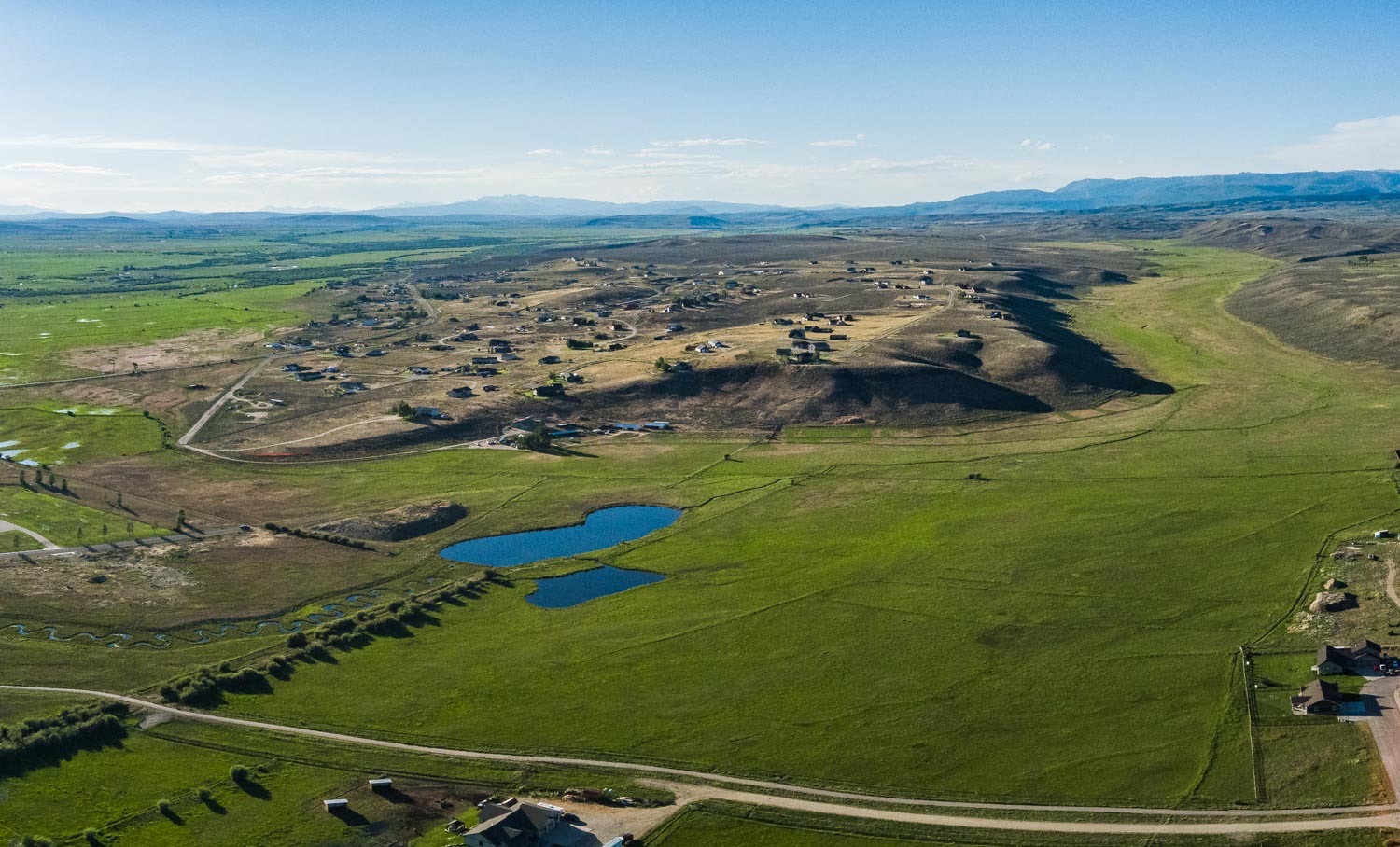 Aerial panorama of the pond and open range