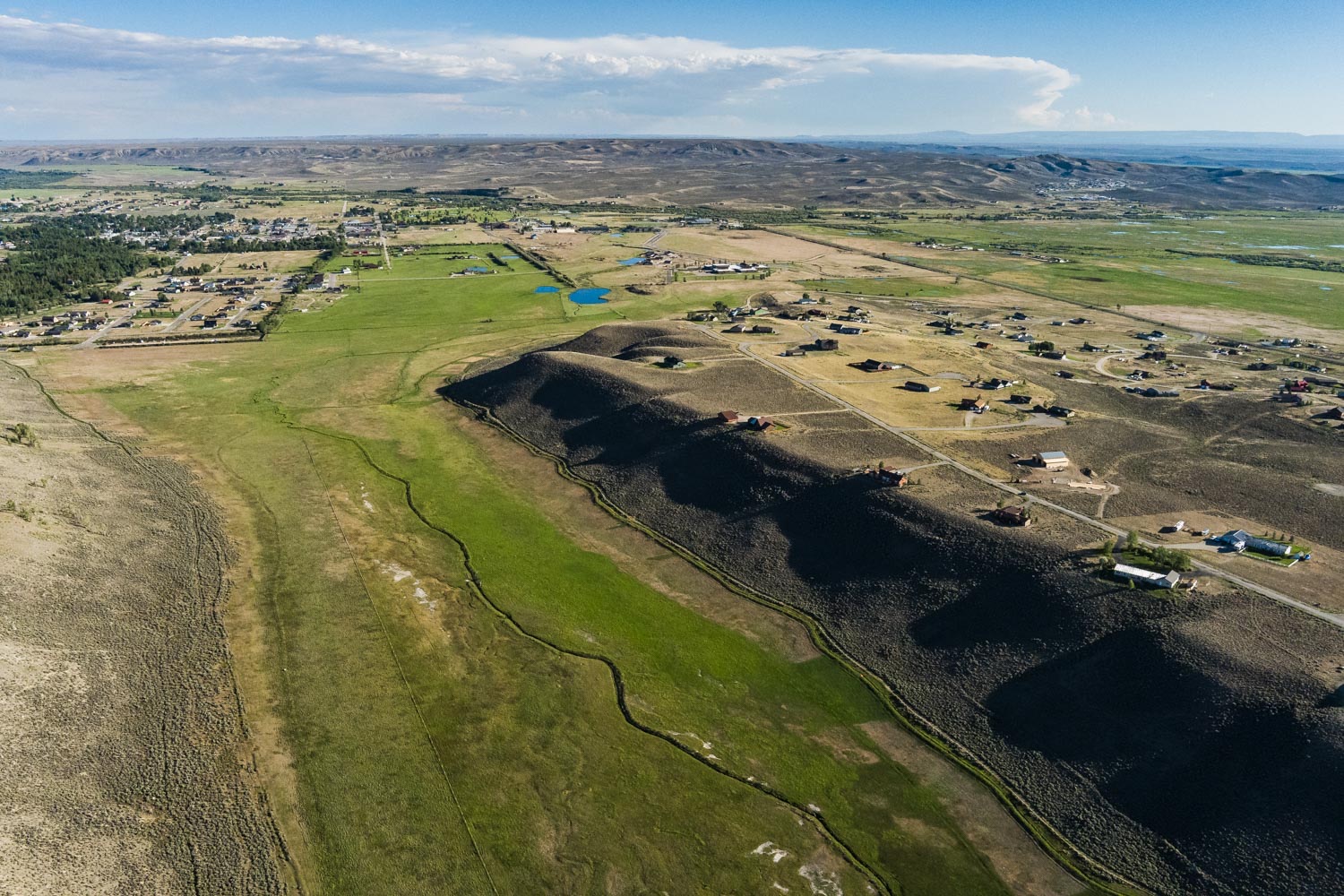 Aerial of the property, creek corridor, and neighboring homes