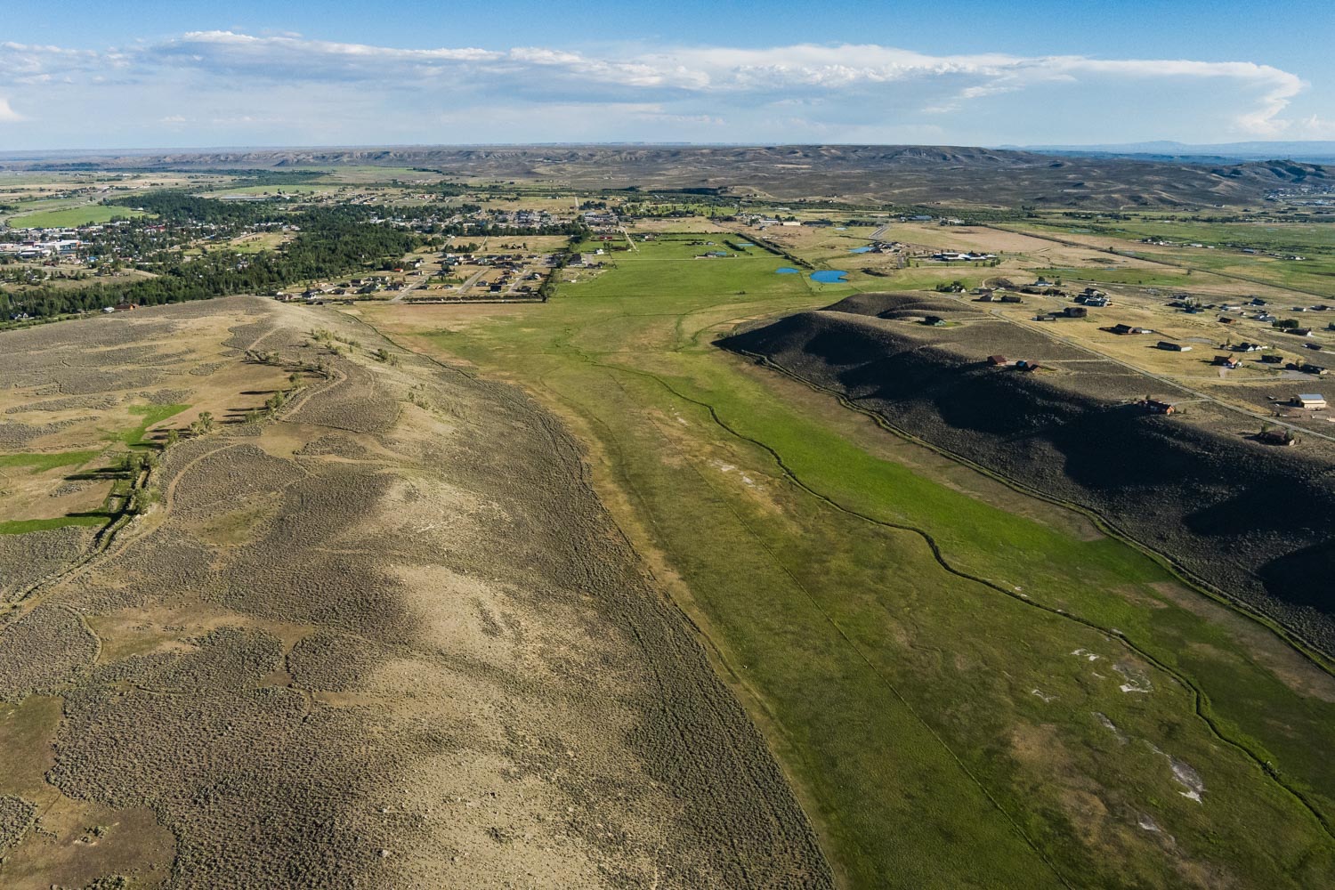 Aerial of the meadow and drainage across the property